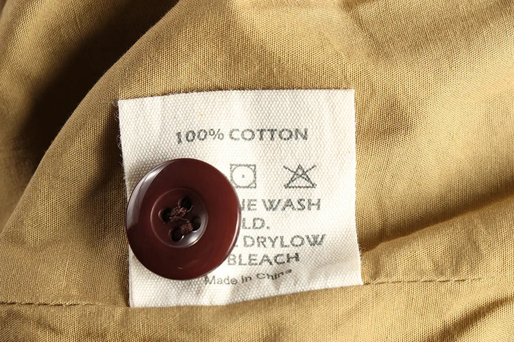 Cotton lining, care label and spare button inside the Corduroy Worker Blazer