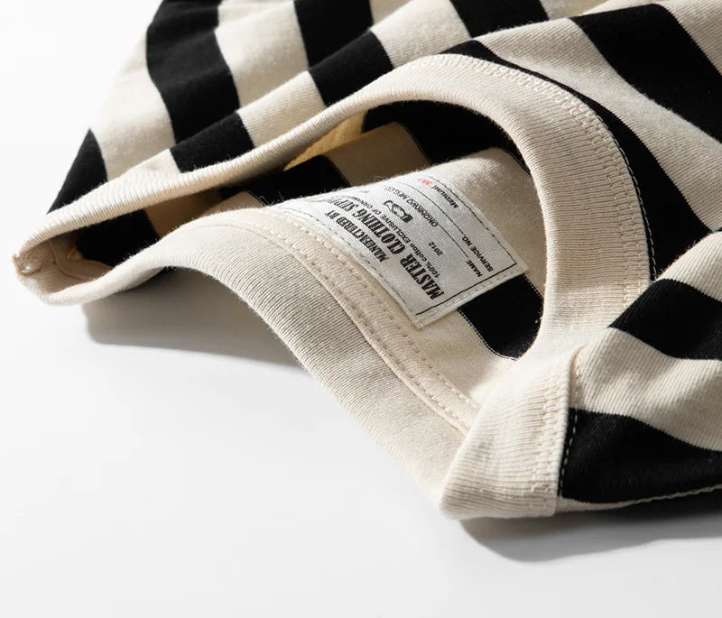 Hem of the tee with the woven label at the side seam