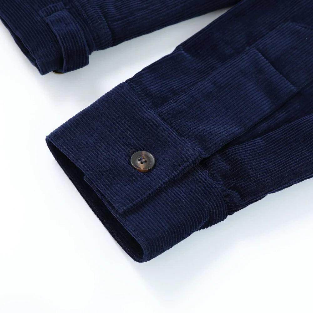 Close-up of the corduroy cuff and button on the Rider Corduroy Jacket in Navy