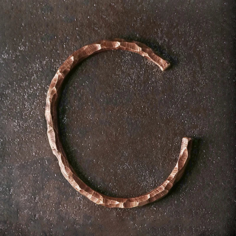 Top view of the open copper cuff showing the gap on the underside