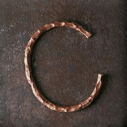 Top view of the open copper cuff showing the gap on the underside