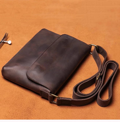 Open Road Leather Crossbody Bag lying flat, showing the whole strap