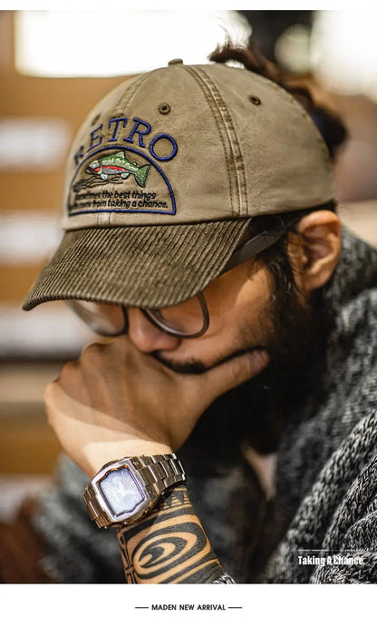 Eddy Corduroy Cap worn with a knit sweater