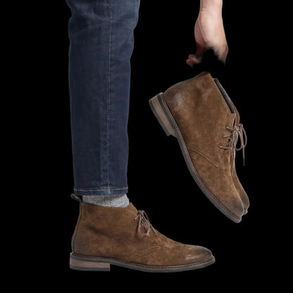 Pampa Suede Chukka Boot worn with dark jeans, holding the pair