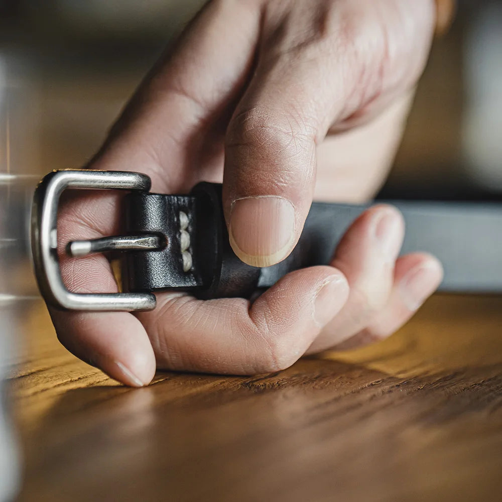 Macro of the single prong buckle held in the hand