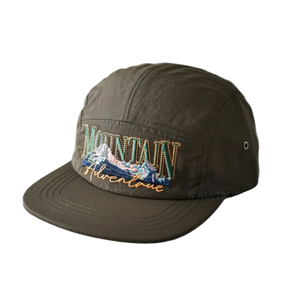 Mountain Adventure Camper Cap in Olive, front view with the embroidery