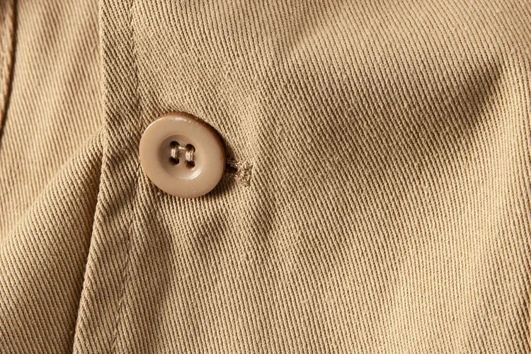 Macro of the flap pocket button on the Khaki cotton twill