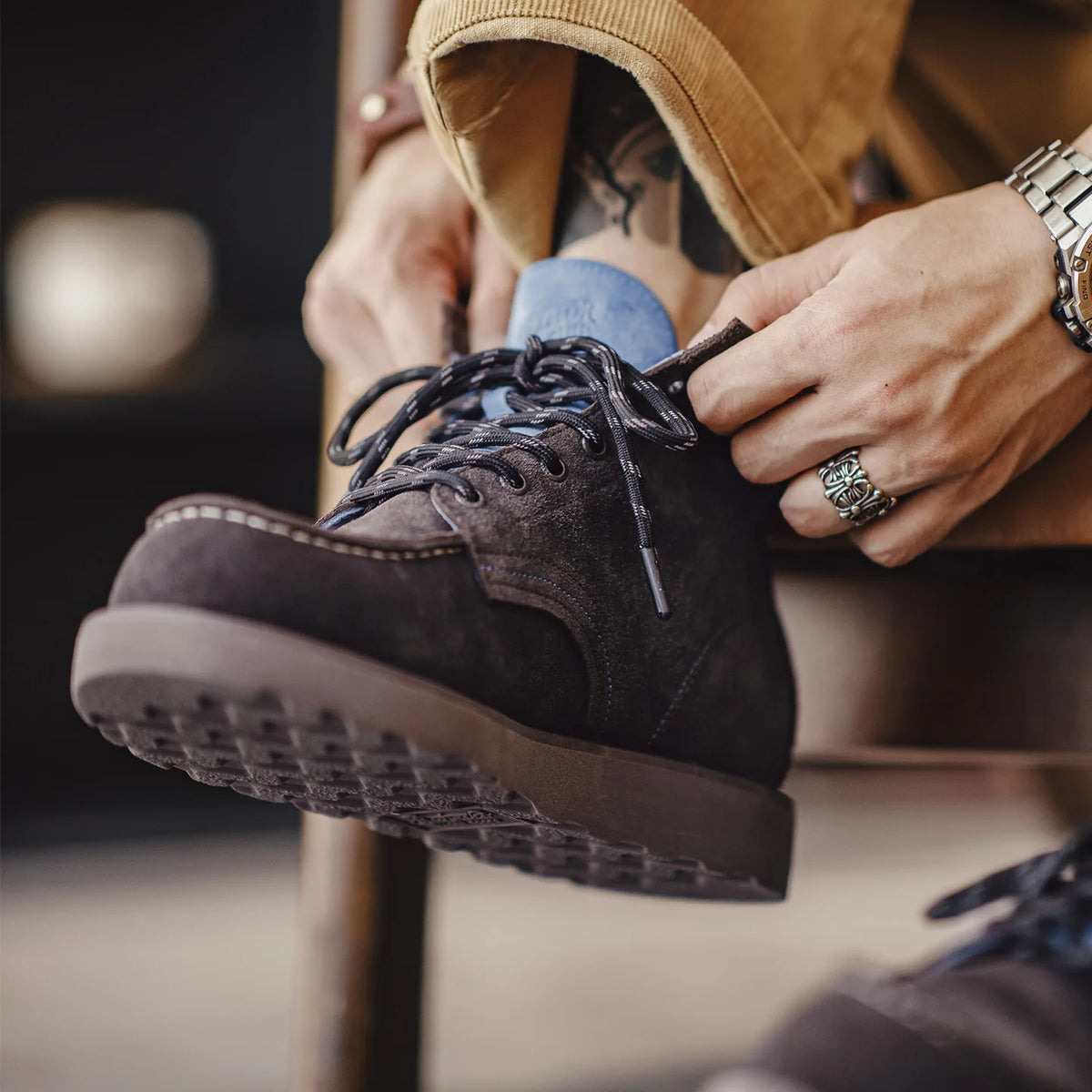 Lacing the boot, showing the traction sole and corduroy hem