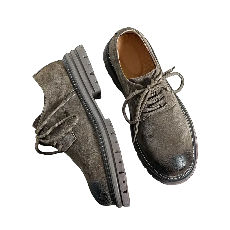 Workshop Suede Derby in Taupe on black, one shoe turned to show the lugged rubber sole