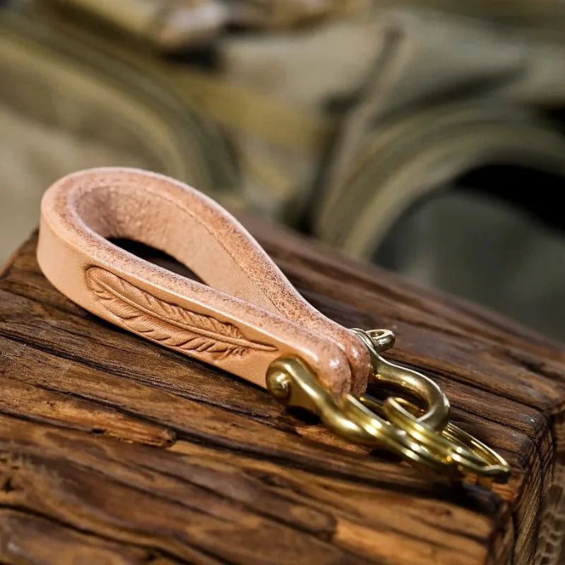 Horseshoe Leather Keychain, Feather model, on wood, seen from above