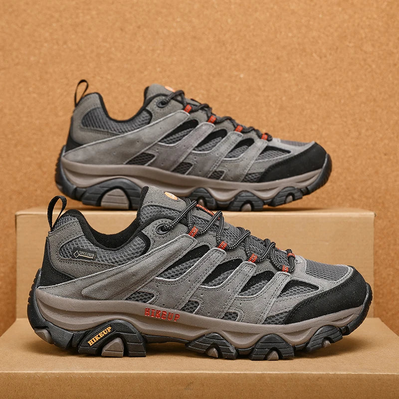 Slate Grey pair on a cardboard box, side view showing the rubber toe rand