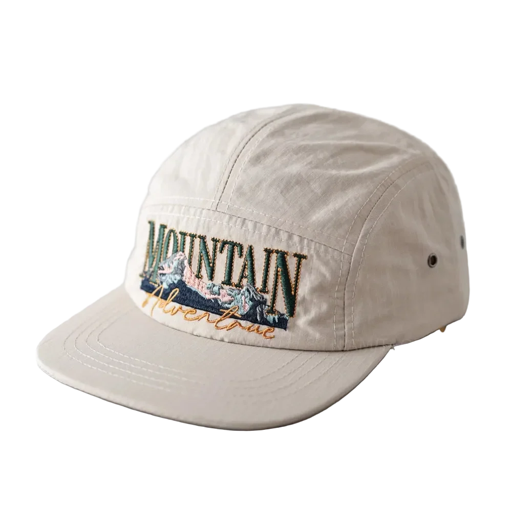 Mountain Adventure Camper Cap in Stone, front view with the embroidery