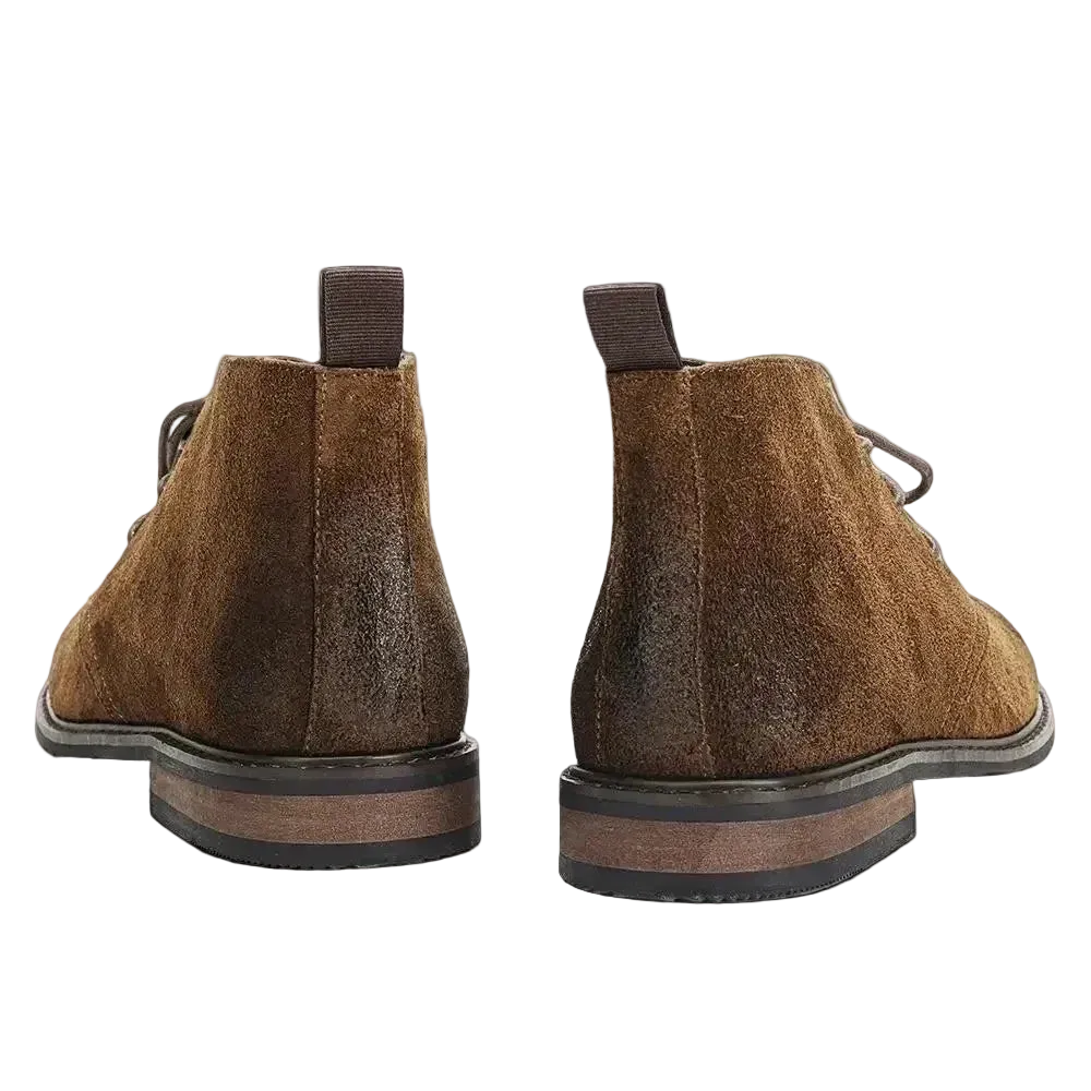 Pair of Pampa Suede Chukka Boots seen from behind, pull tab and stacked heel