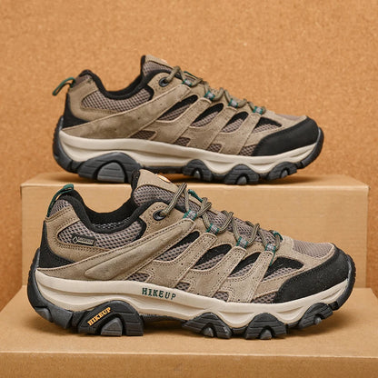 Khaki pair on a cardboard box, side view showing the rubber toe rand