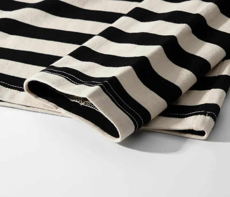Sleeve cuff of the striped tee folded over