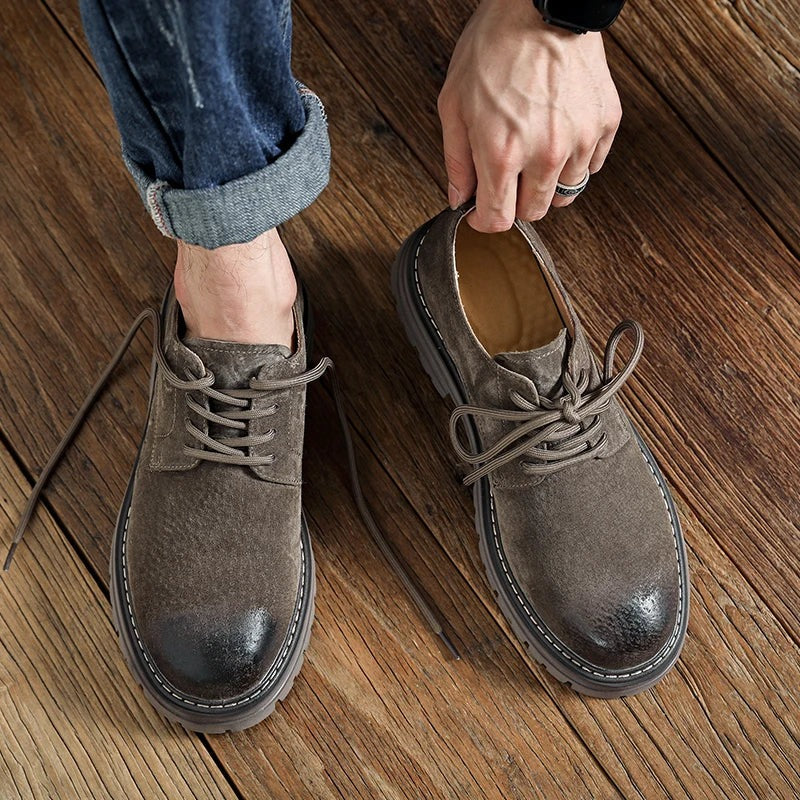 Workshop Suede Derby in both colors, Camel on the foot and Taupe held in hand, seen from above