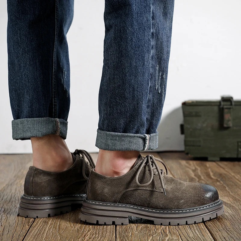 Workshop Suede Derby in Taupe, side view on the foot, with rolled jeans