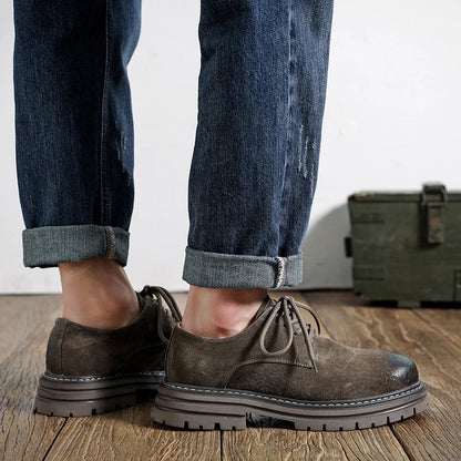 Workshop Suede Derby in Taupe, side view on the foot, with rolled jeans